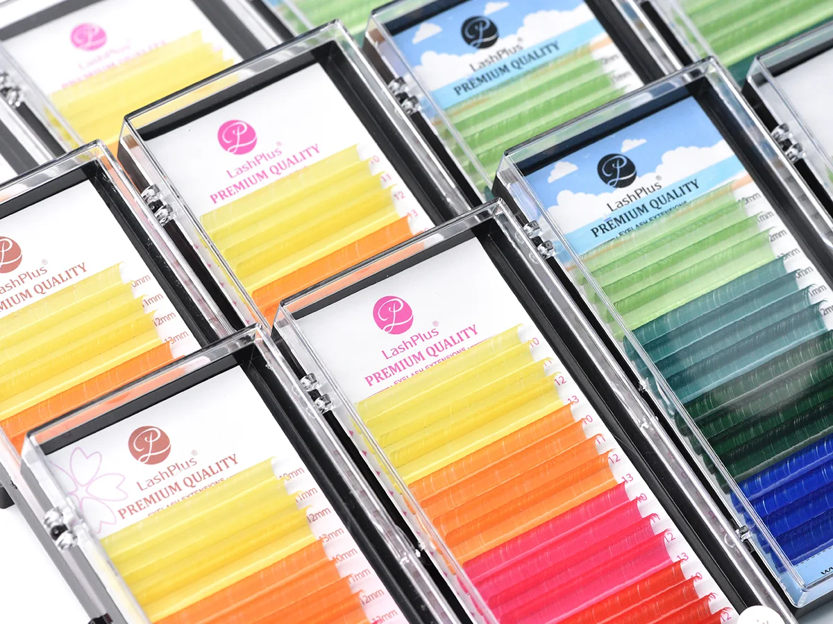 LashPlus colored lash extension trays stacked, yellow to green