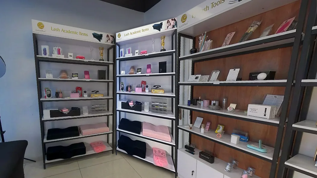 Showroom shelves of eyelash extension supplies