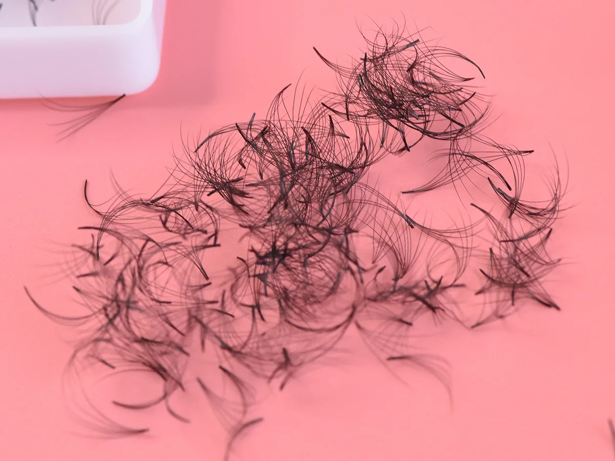 Loose handmade volume fans tipped out of their case