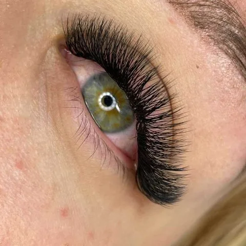 Doll / Open-Eye lash extension style — applied set, client photo