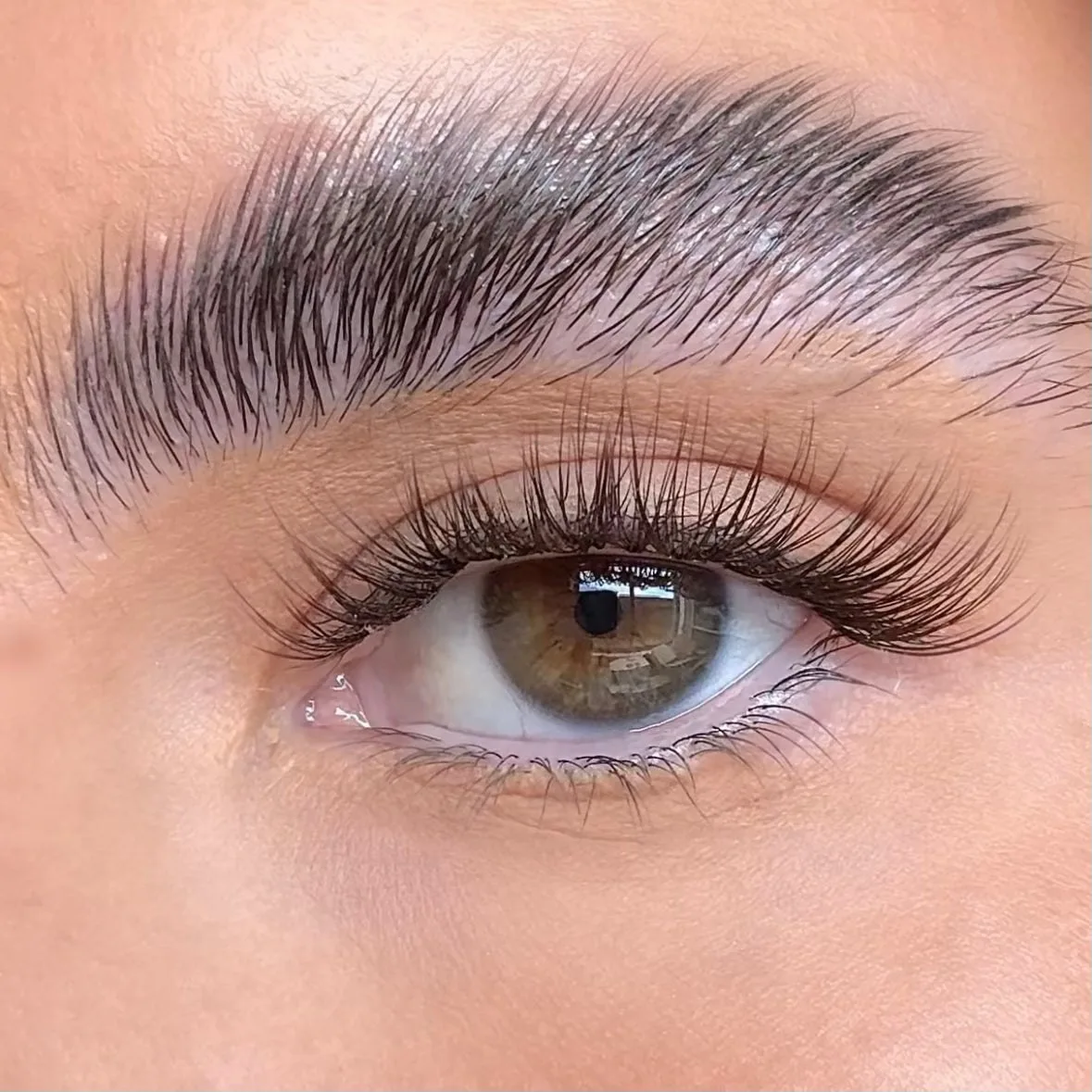 Natural lash extension style — applied set, client photo